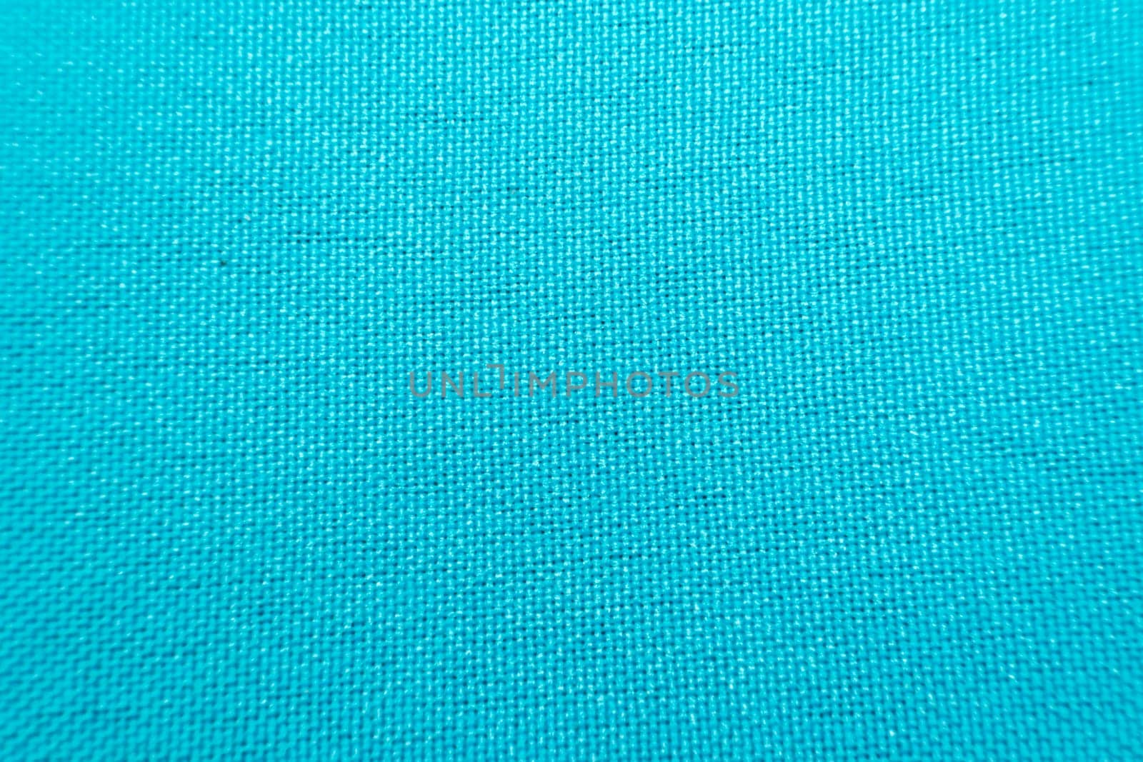 Macro of fabric weave texture surface blue color use for background