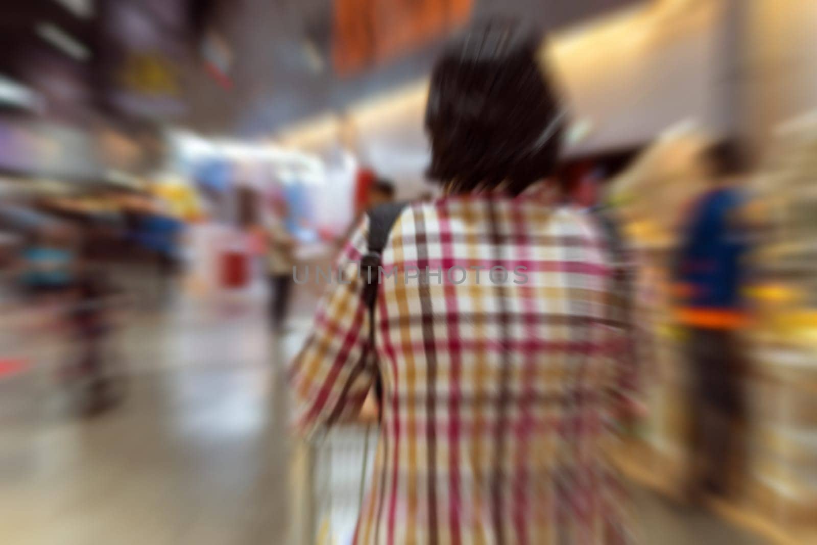 Blurred zoom of Thai woman shopping by shopping cart in Department store or shopping mall is a popular destination for walks and relaxing family in holiday.