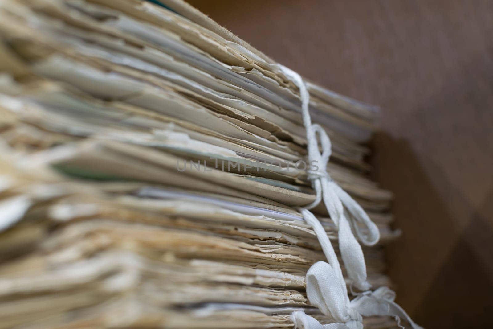 Old files in old folder stacking up in a messy order.