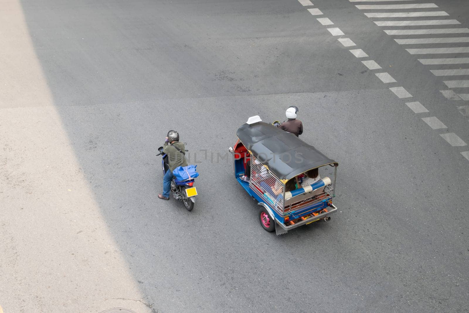 Thai TukTuk taxi parking in the row on the road in Bangkok, Thailand.