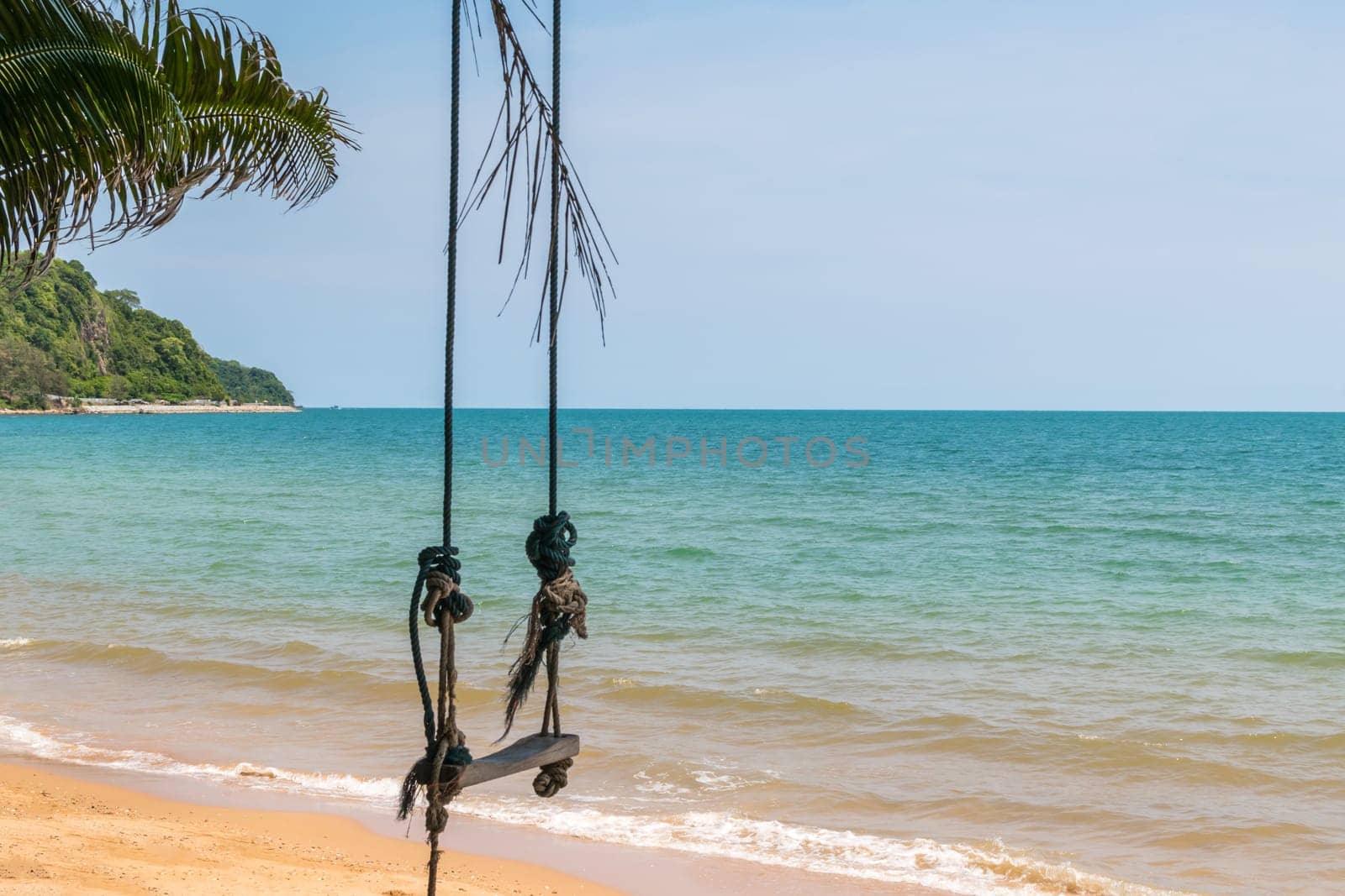 Landscape of travel place with nature at a beach and tropical sea with blue sky and have a outdoor swing use for relax in happy vacation