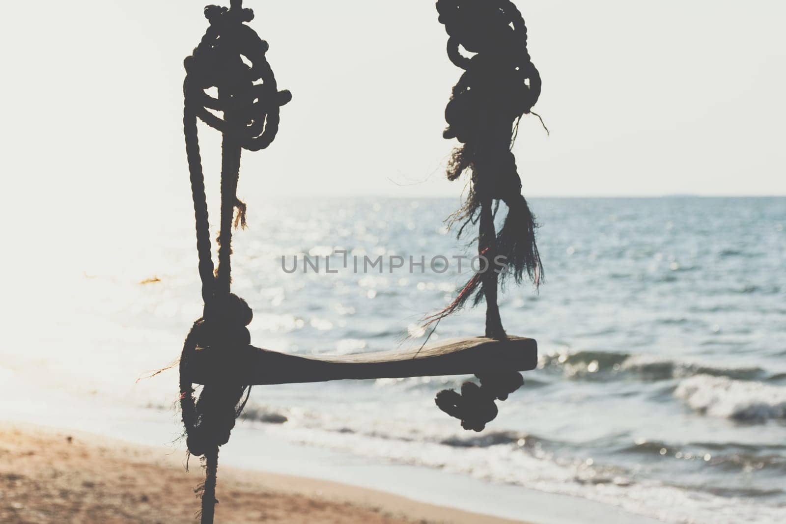 Landscape of travel place with nature at a beach and tropical sea with blue sky and have a outdoor swing use for relax in happy vacation