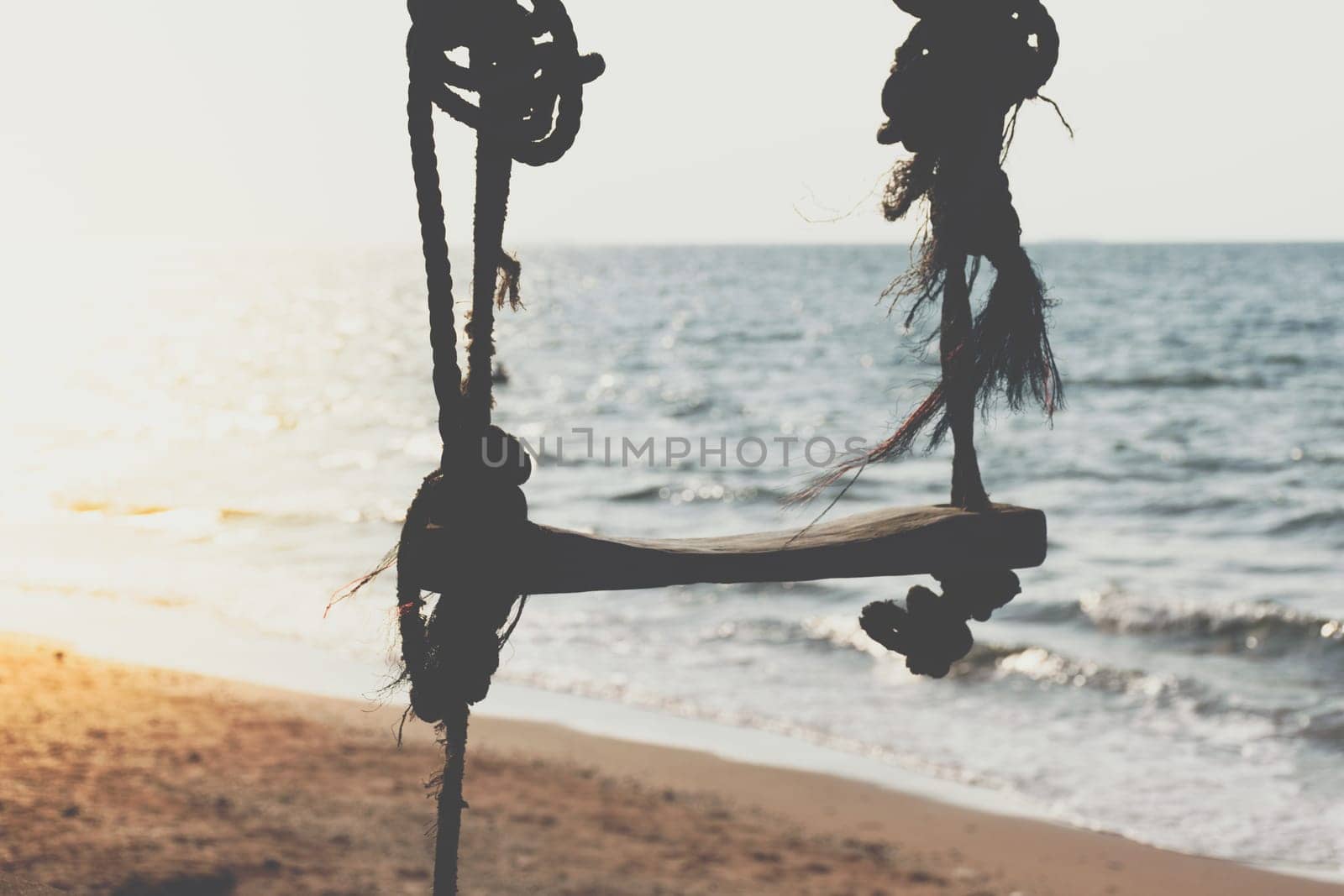Landscape of travel place with nature at a beach and tropical sea with blue sky and have a outdoor swing use for relax in happy vacation