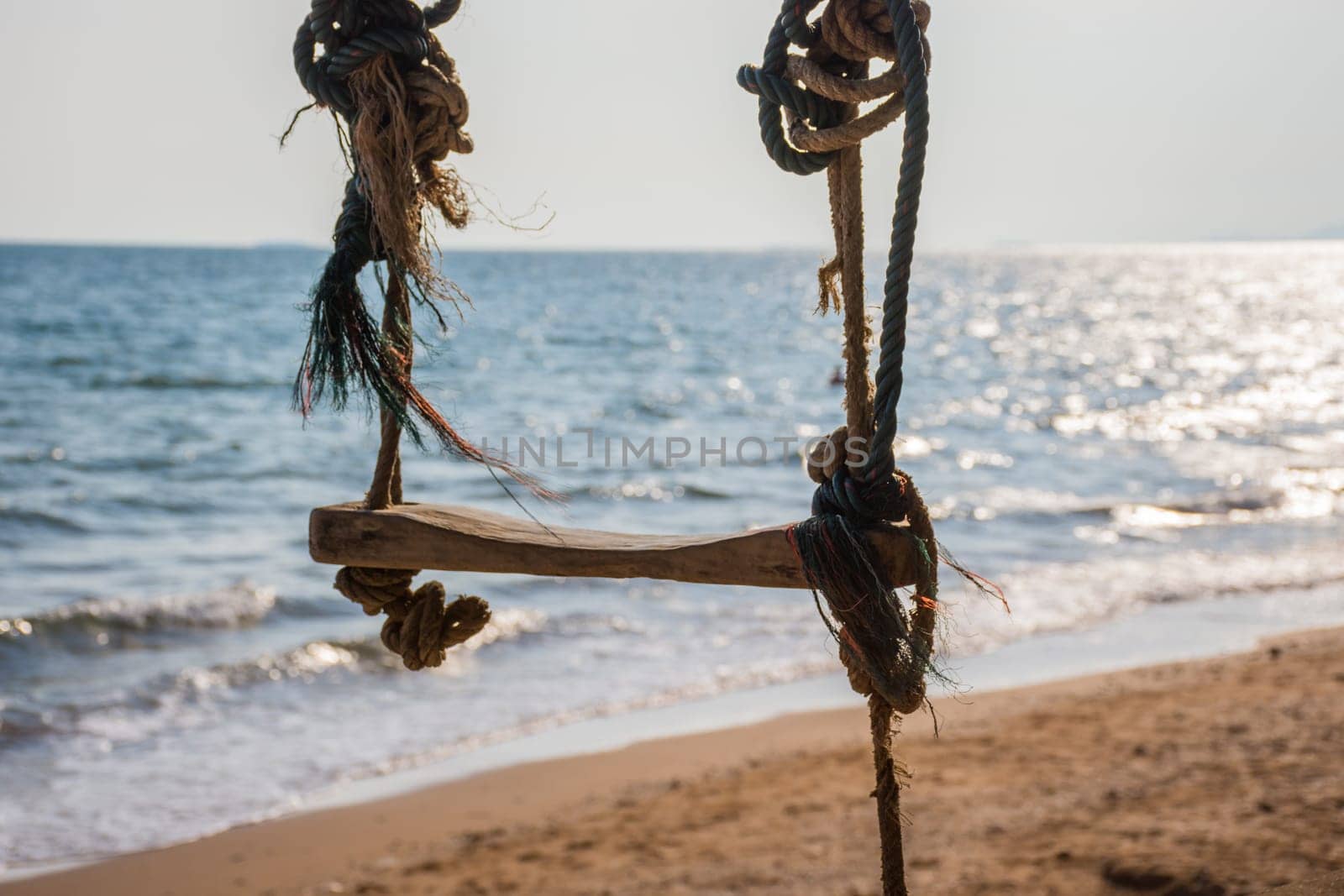 Landscape of travel place with nature at a beach and tropical sea with blue sky and have a outdoor swing use for relax in happy vacation