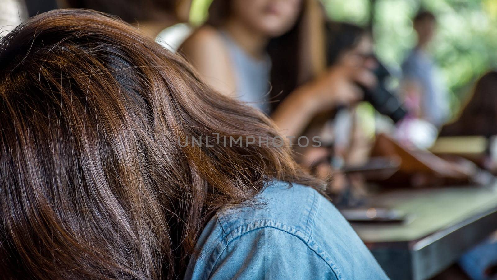 Asia woman take a photo by her camera at restaurant or cafe when travel with her best friends