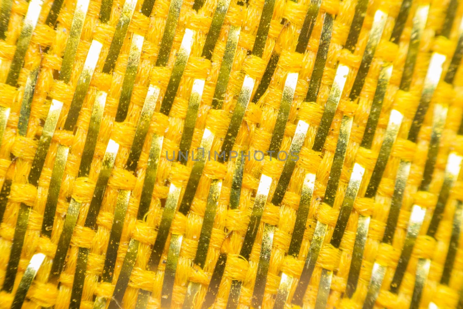 Macro of fabric weave texture surface yellow or orange color use for background