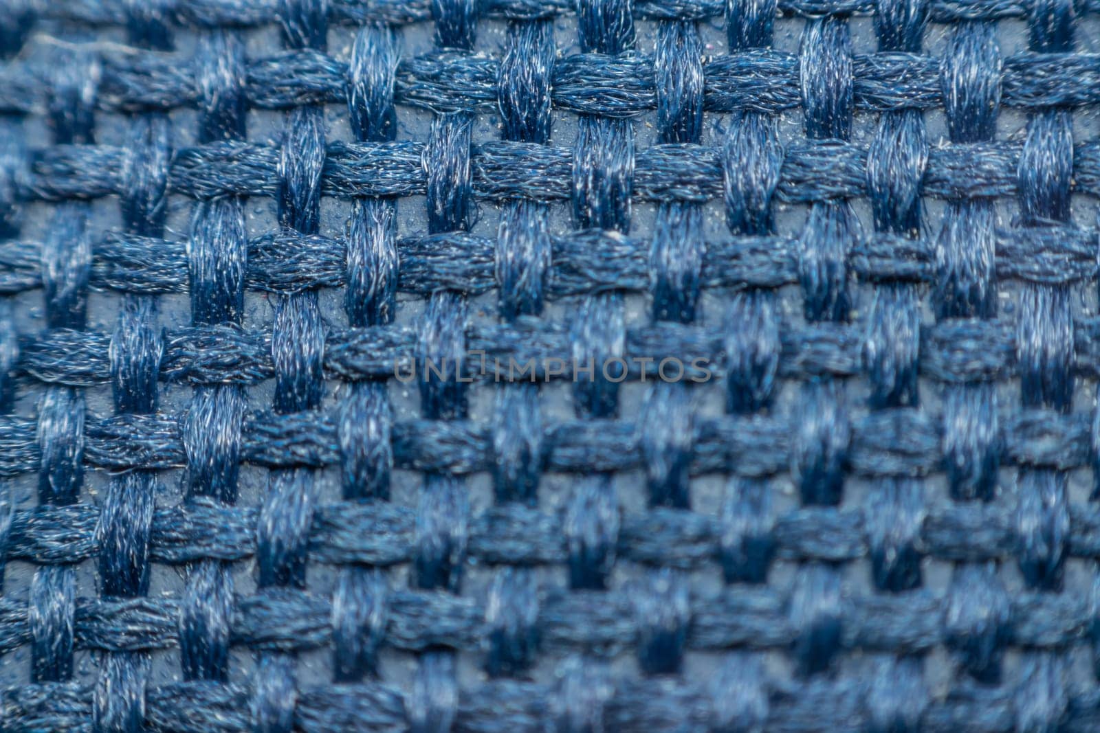 Macro of fabric weave texture surface blue or indigo blue color use for background