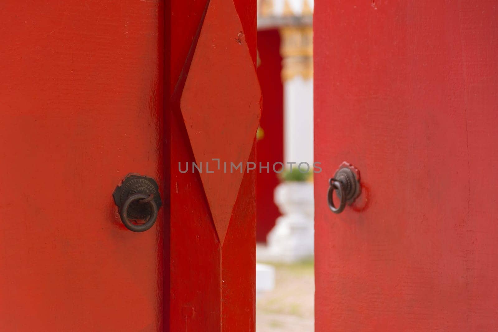 Buddhist temple gate with wooden door red color vintage style