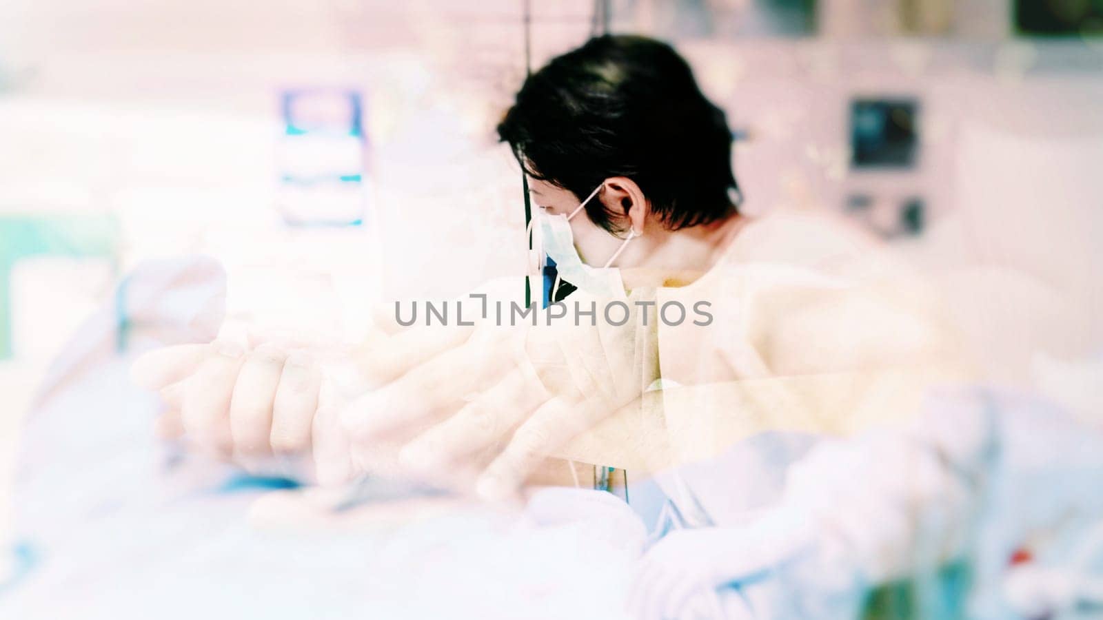 Asian women 40s years old in gown coat is a patient relative taking care of the CRE. or VRE. infected elder patient 80s years old on bed in the hospital.