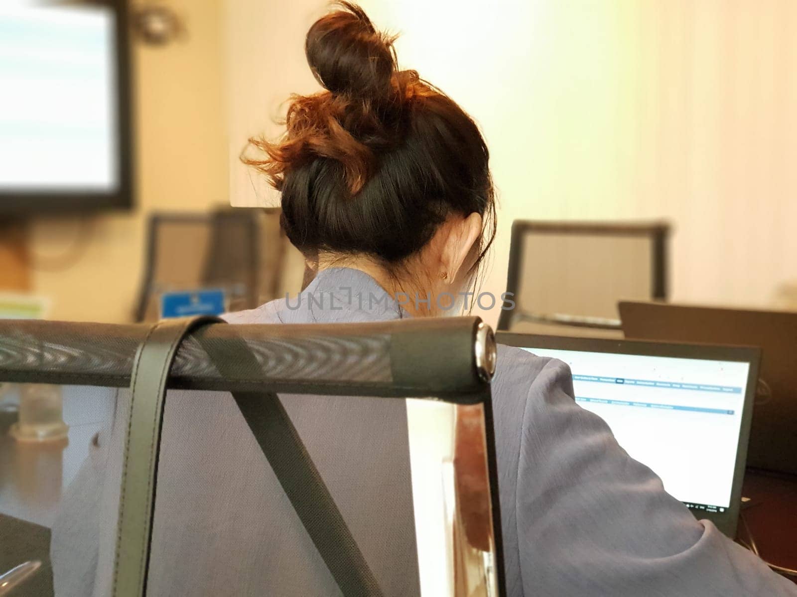 Asian business woman discussion with team and work by laptop or computer notebook in meeting room at her corporate office