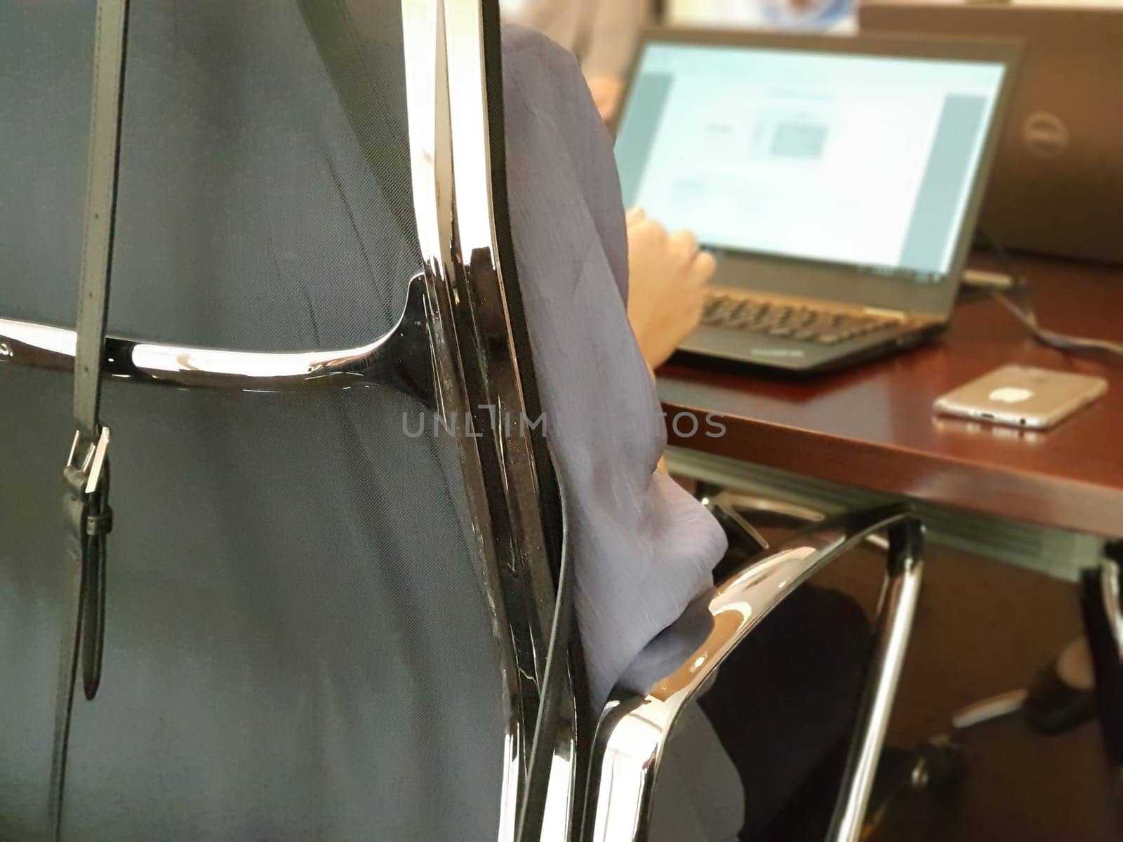 Asian business woman discussion with team and work by laptop or computer notebook in meeting room at her corporate office