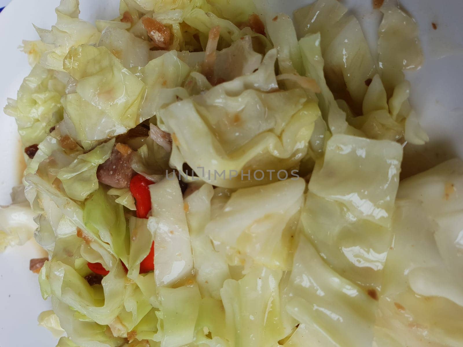 Stir fried celery cabbage with salted fish for sale at Thai street food market or restaurant in Thailand