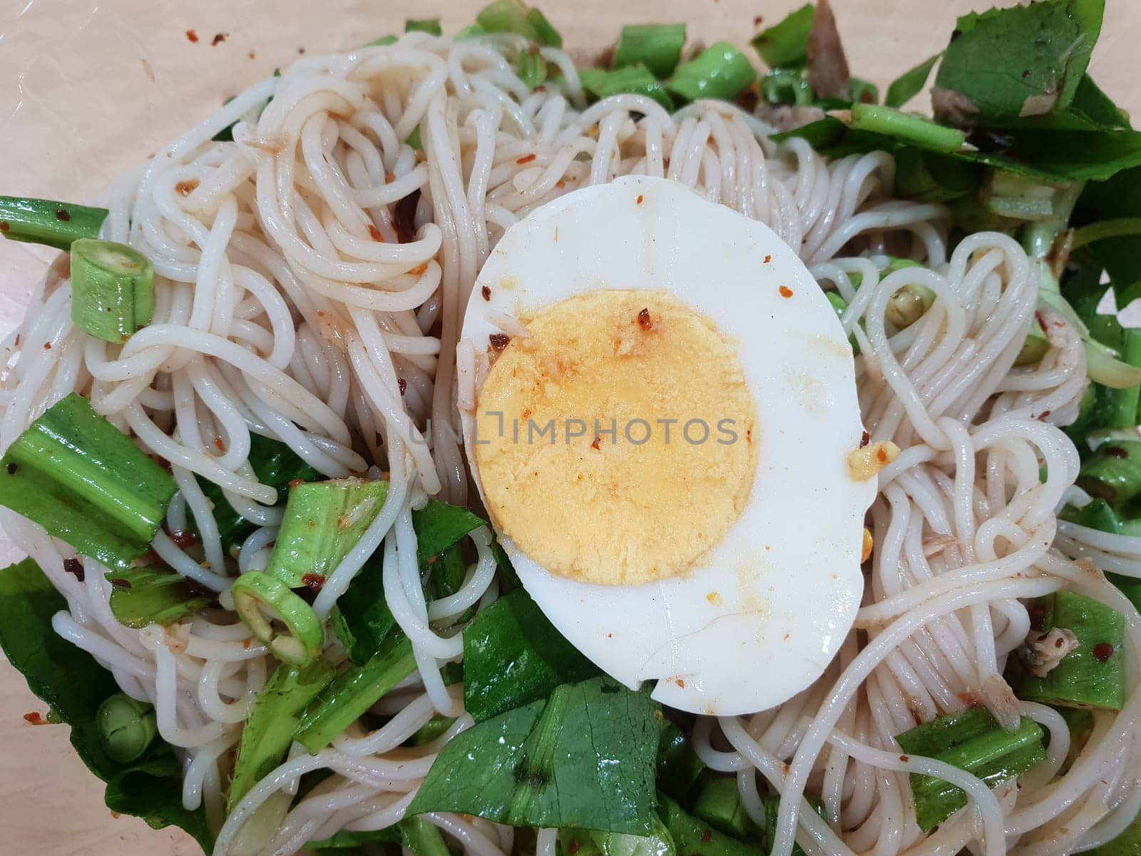 Rice vermicelli noodle spicy salad with mackerel for sale at Thai street food market or restaurant in Thailand