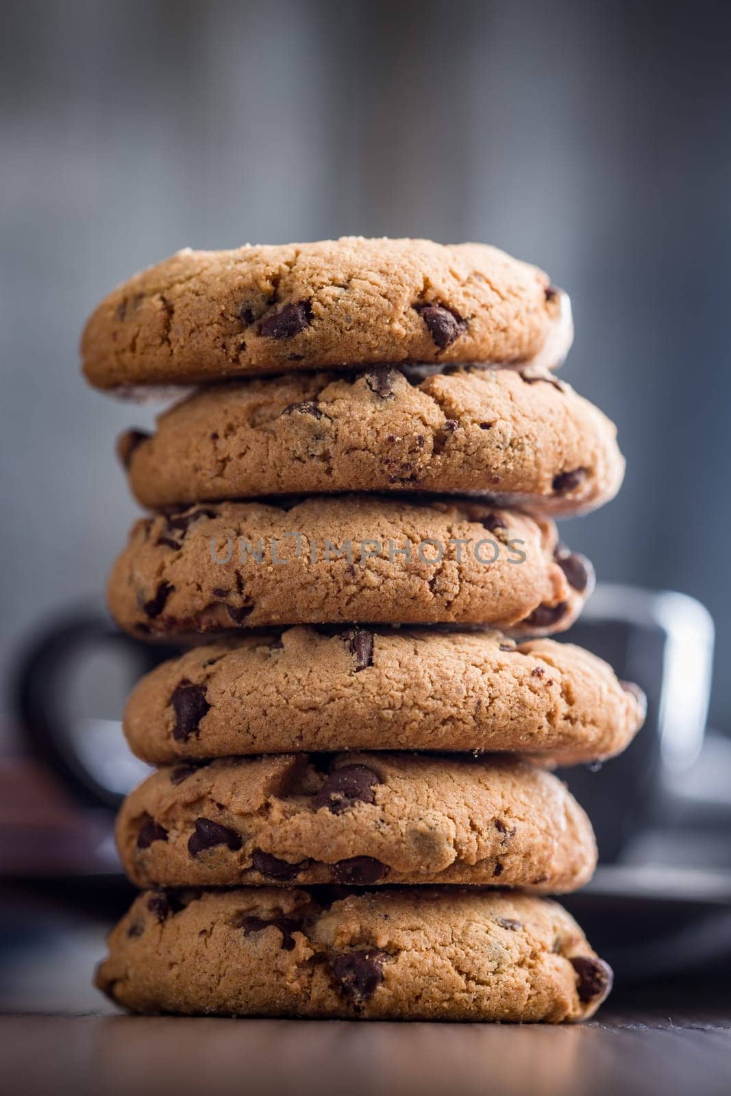 Chocolate chip cookies on a wooden table.
