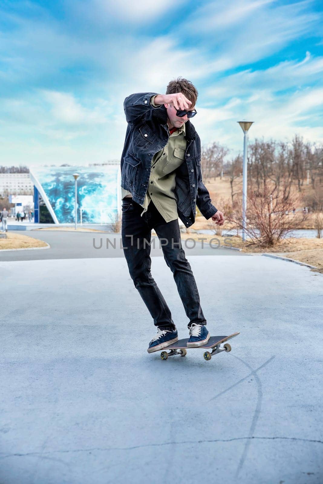 Young man riding a skateboard making tricks and jumps