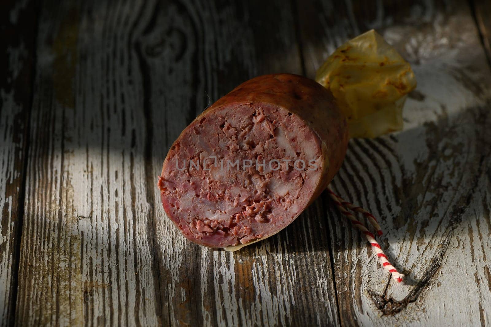A beautiful piece of handmade meat showcases rich texture and craftsmanship, beautifully lit by soft evening light.