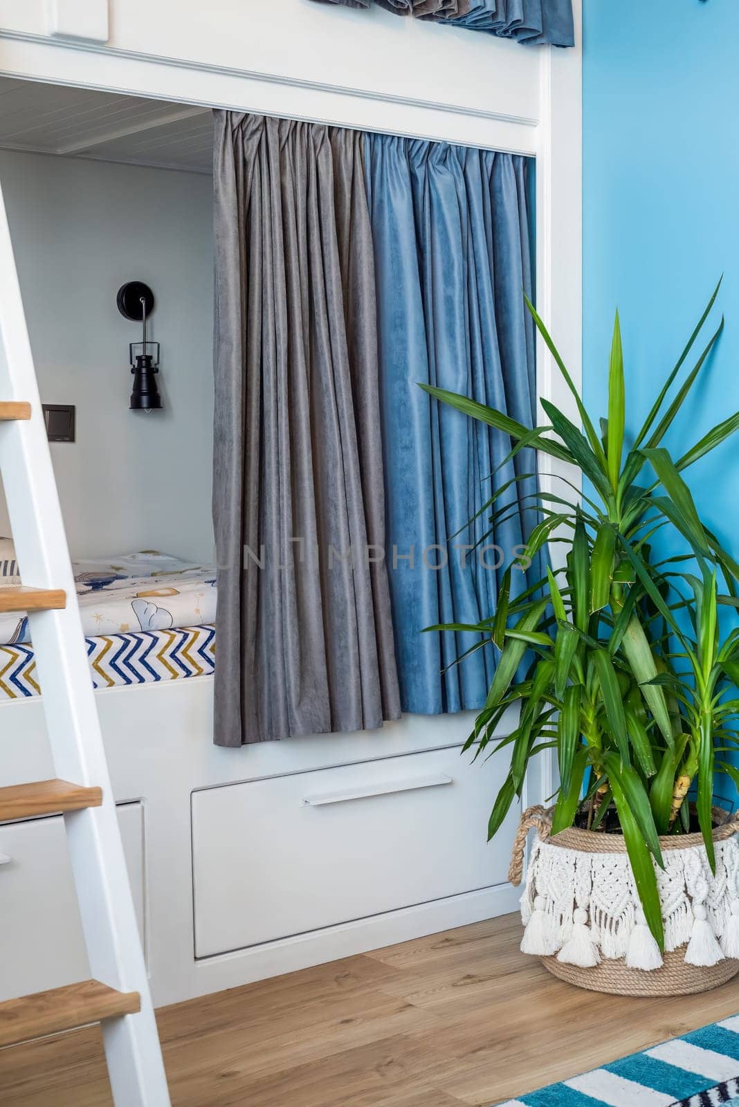 Blue curtains for bunk bed for boys in the bedroom without people