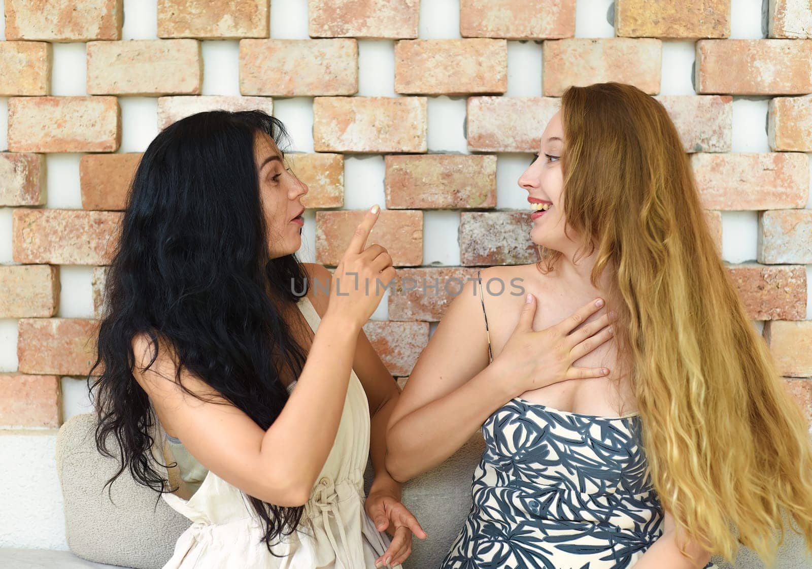 Russian beautiful blonde woman talking with her best friend