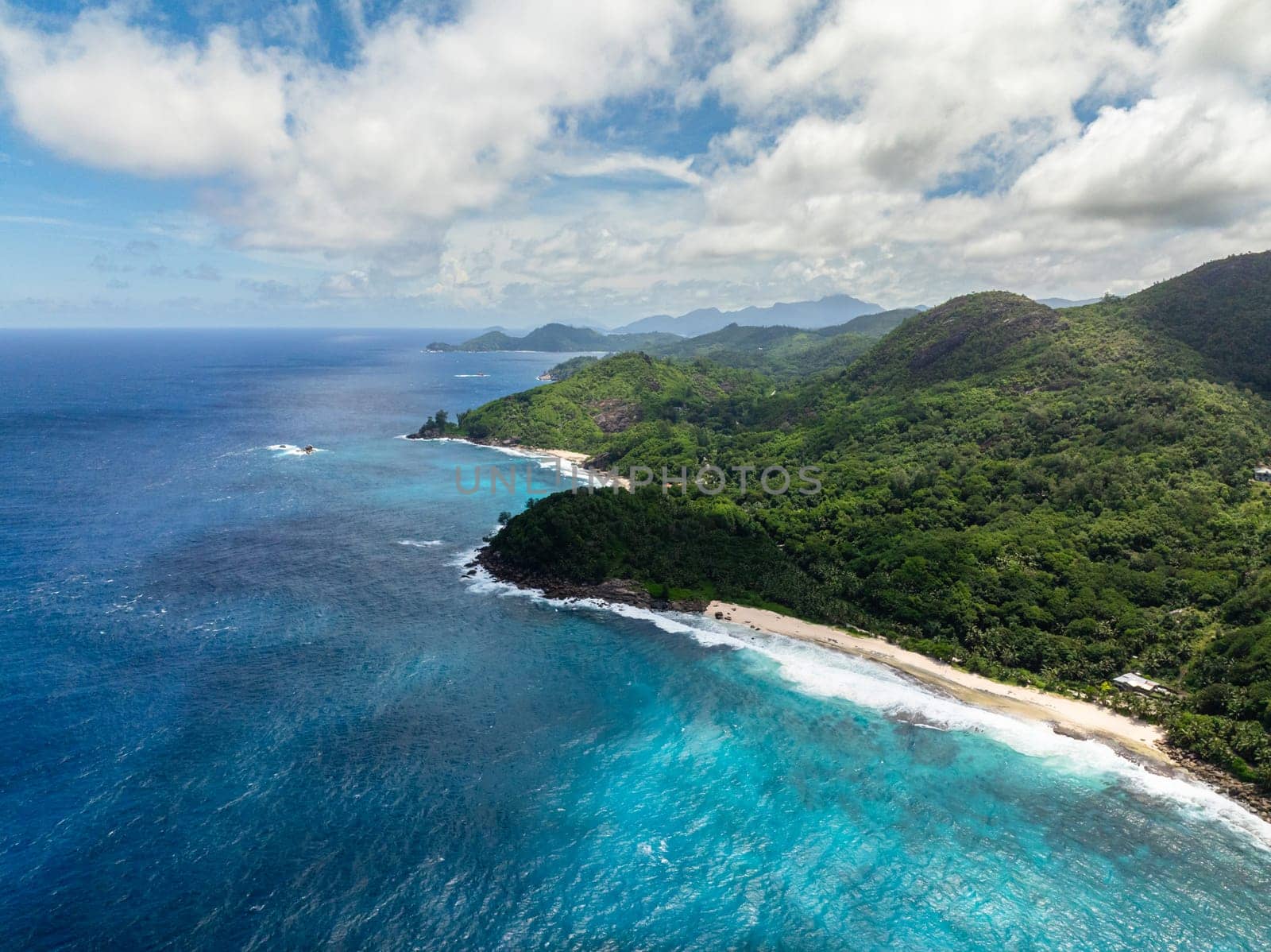 Tropical beach and rocks in turquoise water. Seychelles, Mahe. Anse Bazarca Beach.