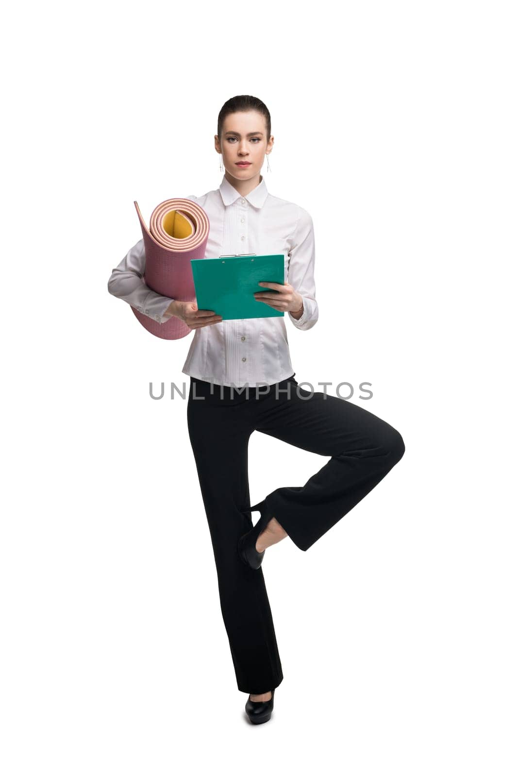 Business woman in white tshirt with green paper pack and mat isolated shot
