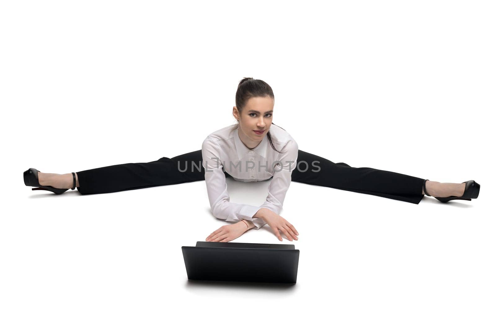 Business woman in white tshirt with notebook sitting on the floor isolated view
