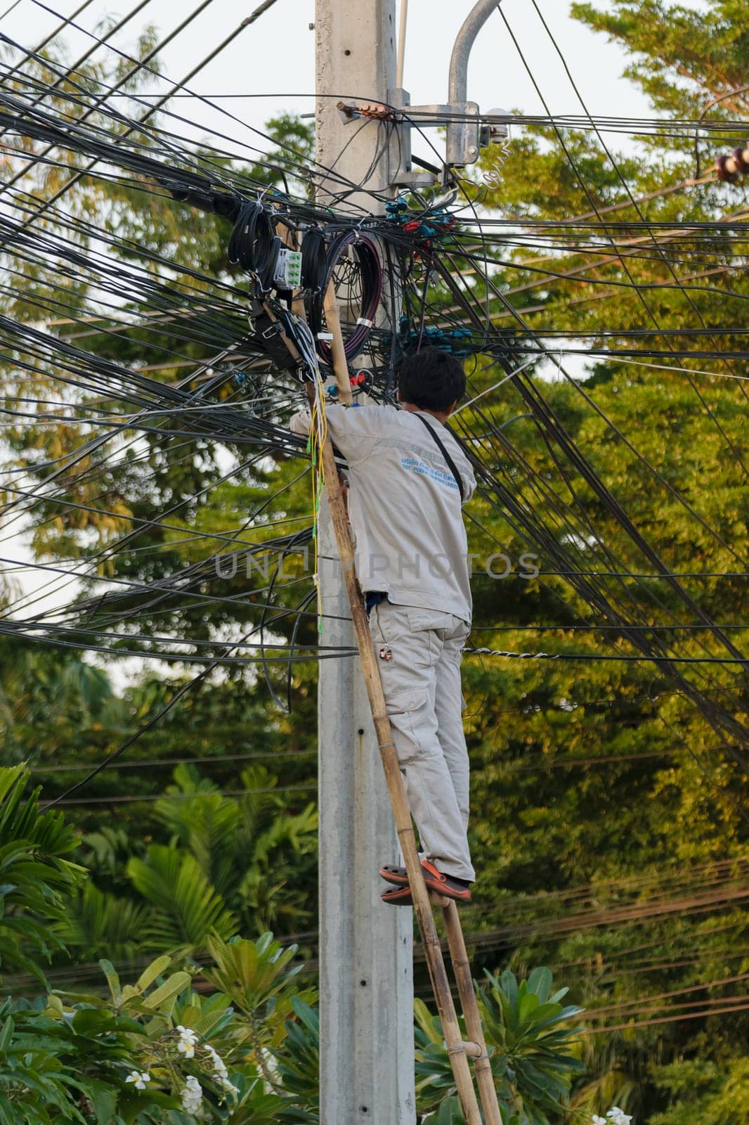 Bangkok, Thailand - November 16, 2015 : Unidentified worker working to install internet fiber system in village at Bangkok Thailand.