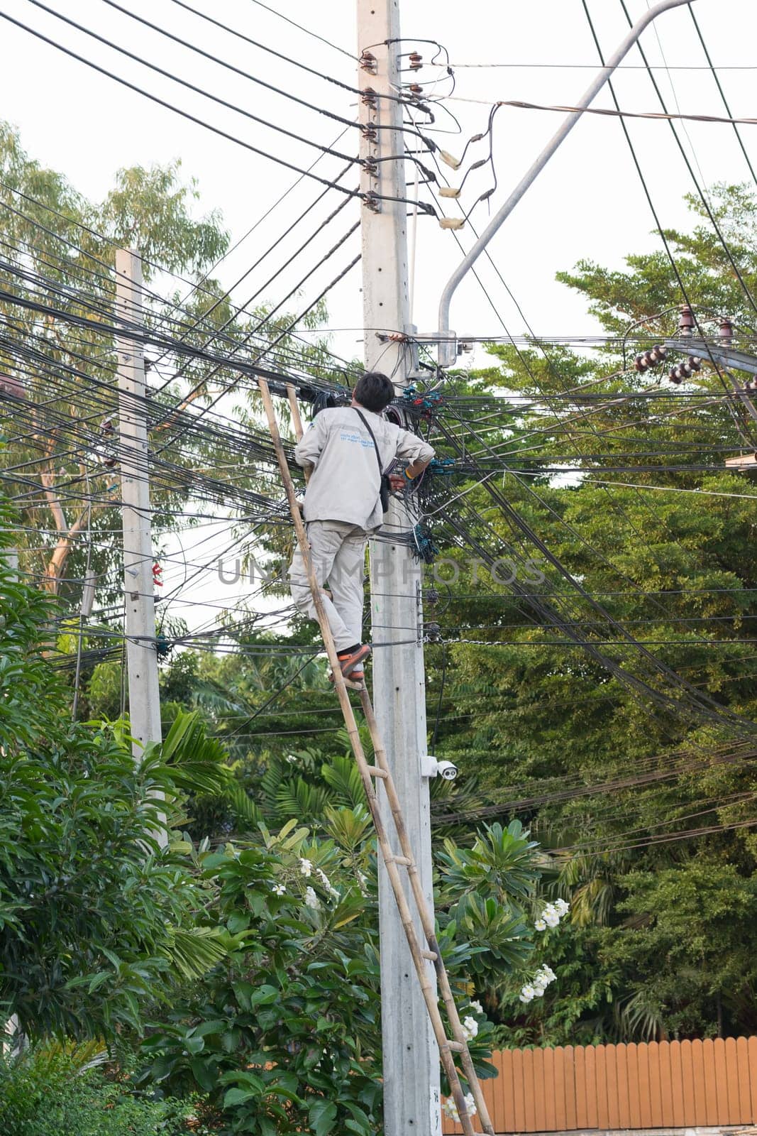 Bangkok, Thailand - November 16, 2015 : Unidentified worker working to install internet fiber system in village at Bangkok Thailand.