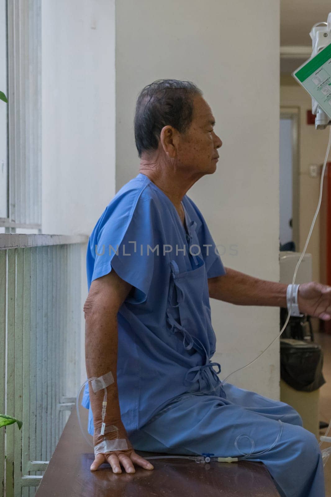 Patient elderly waiting a doctor and nurse in hospital