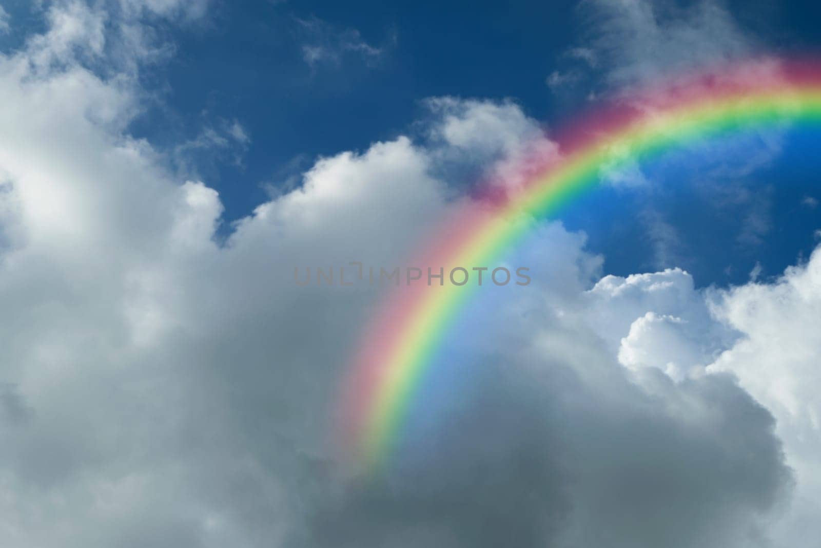 Nature cloudscape with blue sky and white cloud with rainbow