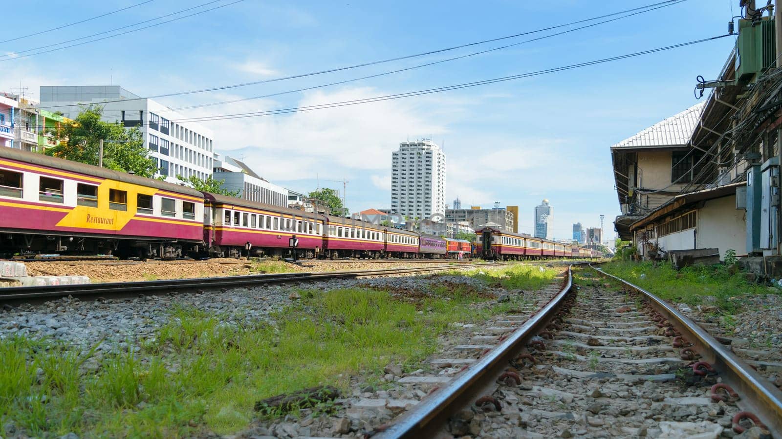 Bangkok, Thailand - August 14, 2015 : Unidentified train run on the railroad tracks. Many people in Thailand popular travel by train because it is cheaper.