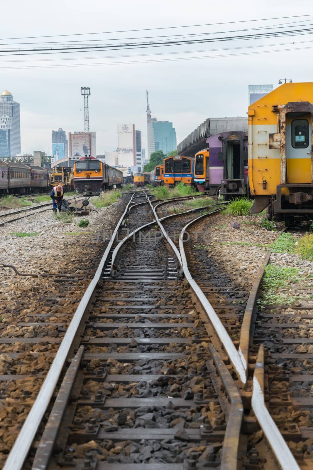 Bangkok, Thailand - September 5, 2015 : Unidentified railway train on the railroad tracks in Bangkok station. Many people in Thailand popular travel by train because it is cheaper.