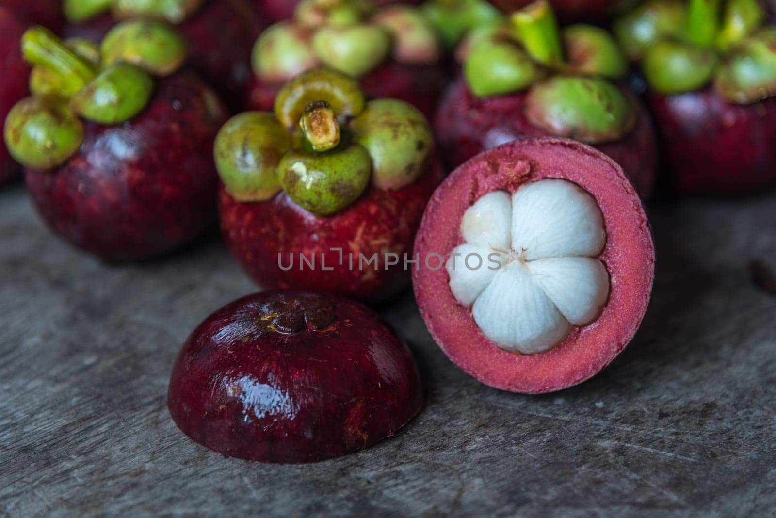 Mangosteen on a wood table is a queen of fruit in Thailand and asia fruit have a sweet can buy at Thai street food and fruit market