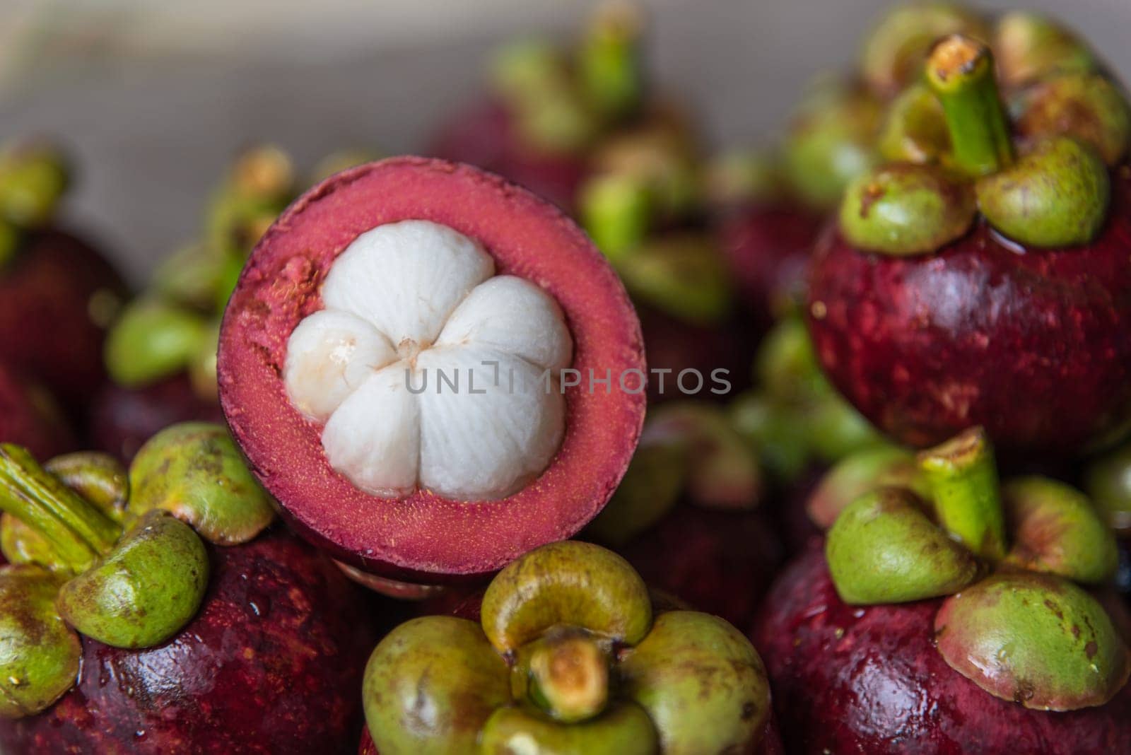 Mangosteen on a wood table is a queen of fruit in Thailand and asia fruit have a sweet can buy at Thai street food and fruit market
