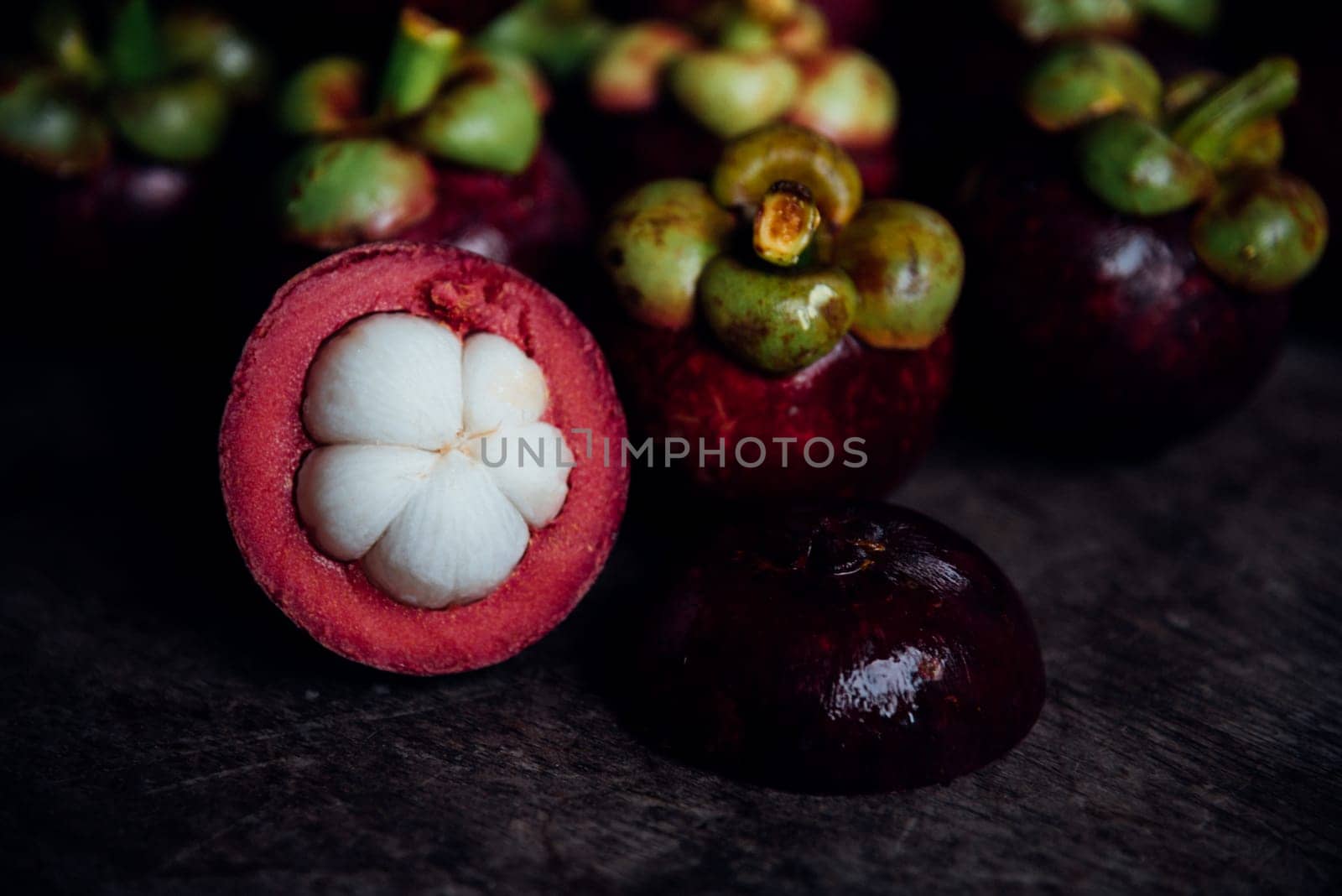 Mangosteen on a wood table is a queen of fruit in Thailand and asia fruit have a sweet can buy at Thai street food and fruit market
