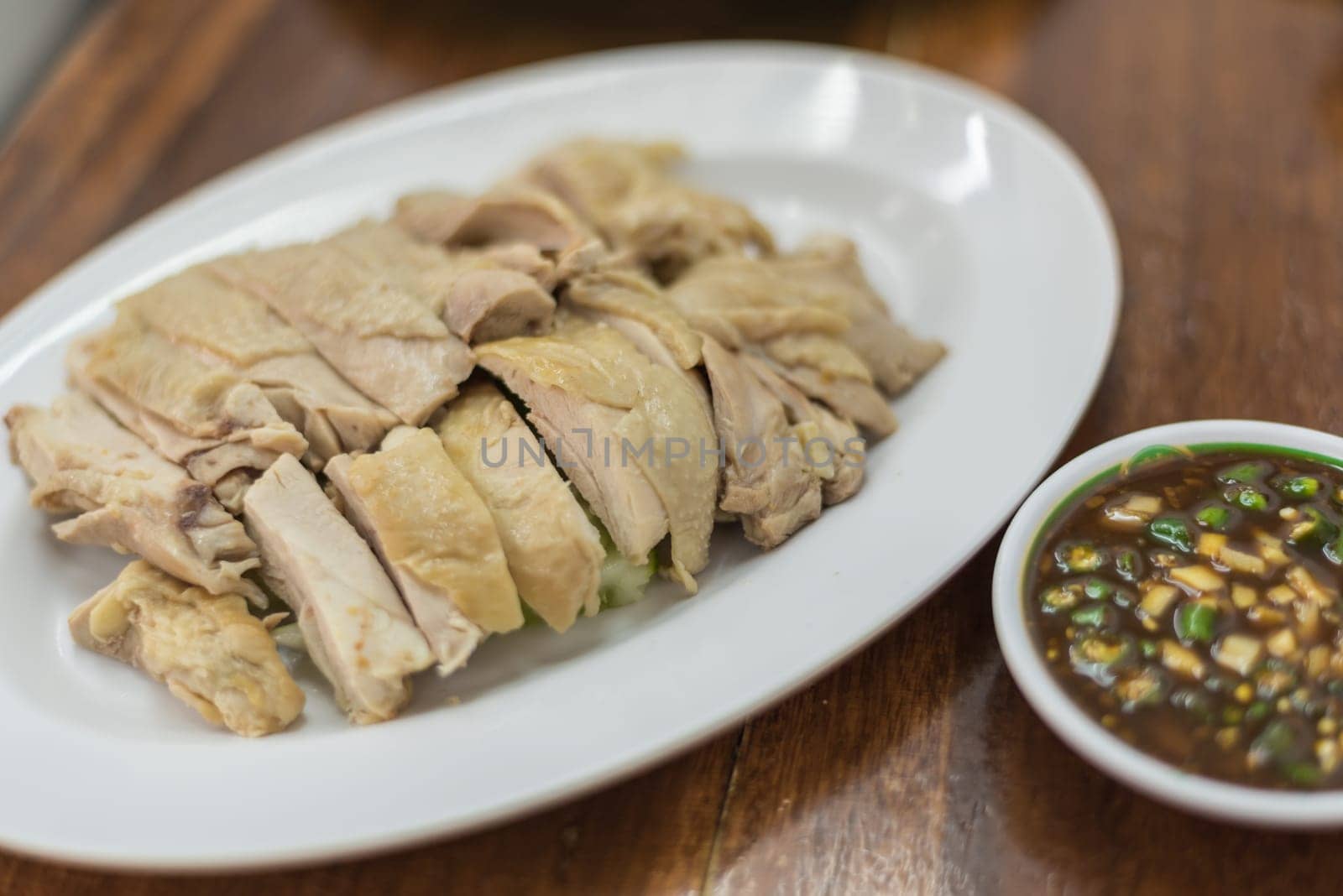 Rice steamed with chicken soup (hainanese chicken rice) for sale at Thai street food market.