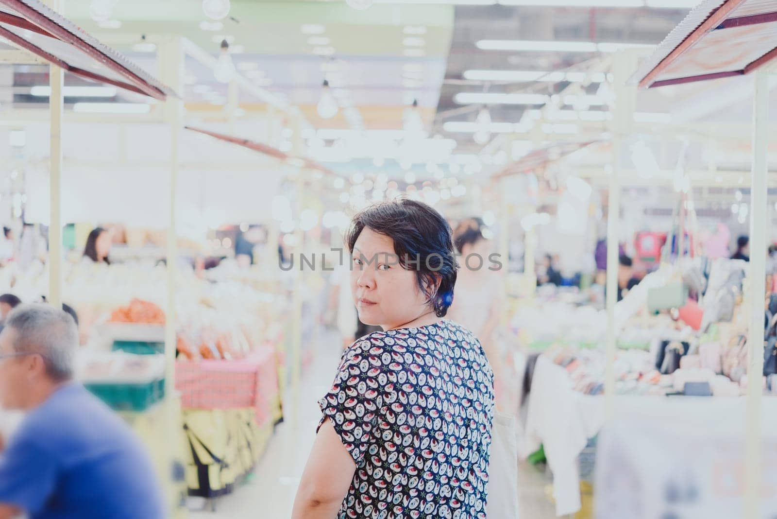 Woman shopping at Thai street food market vintage style can buy food vegetable and fruit in cheap price.