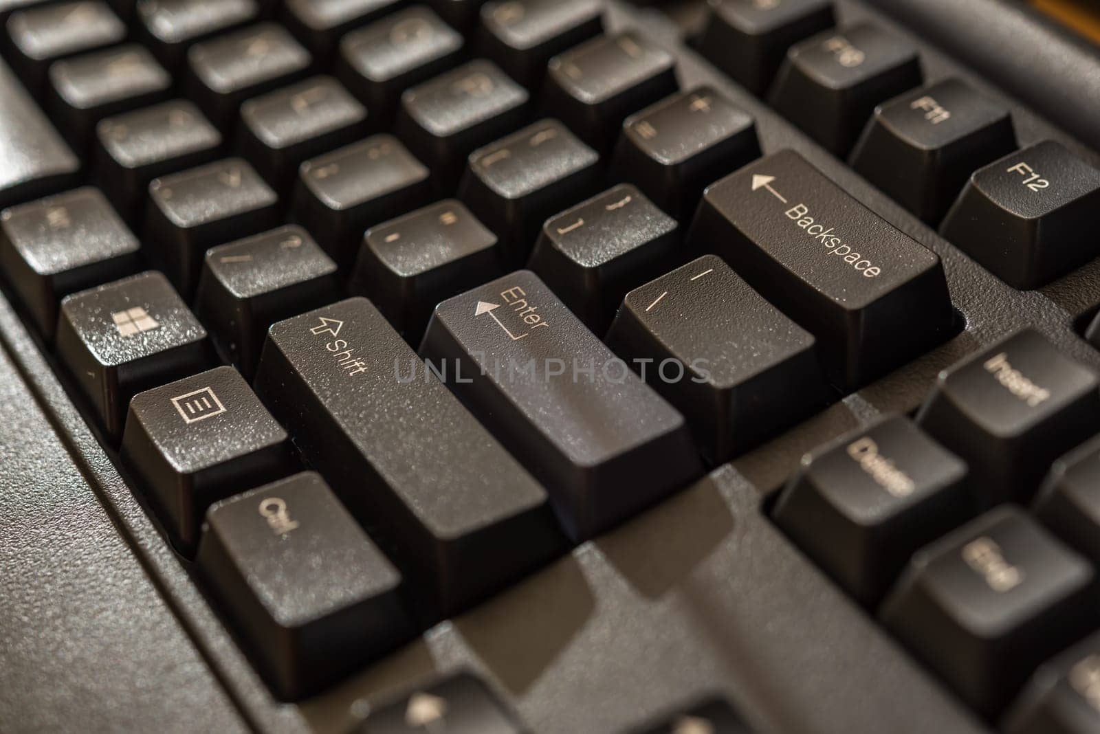Keyboard for computer server or desktop computer focus on shift button on a keyboard in office, business and information technology concept