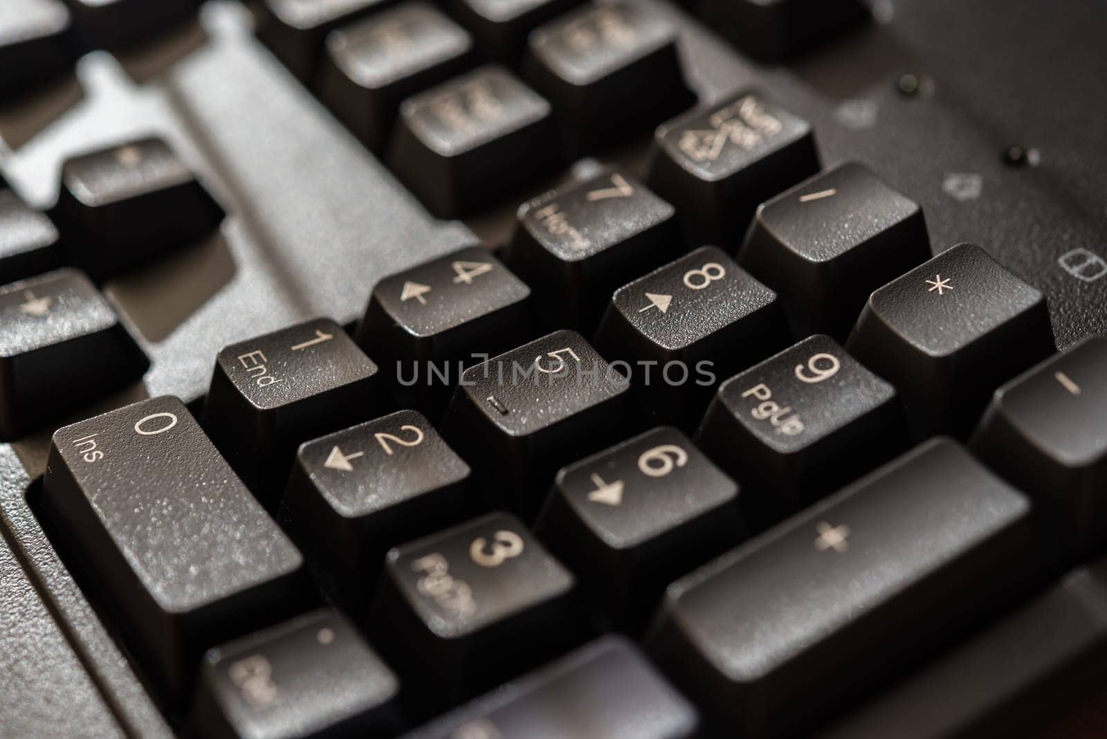 Keyboard for computer server or desktop computer focus on numeric keypad button on a keyboard in office, business and information technology concept
