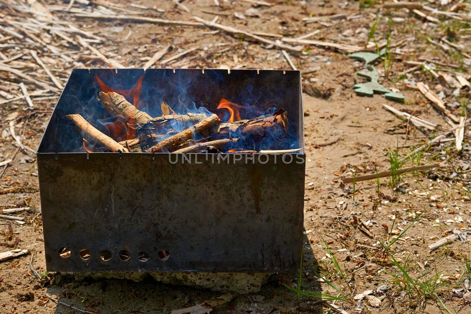 a portable heater consisting of a pan or stand for holding lighted coals