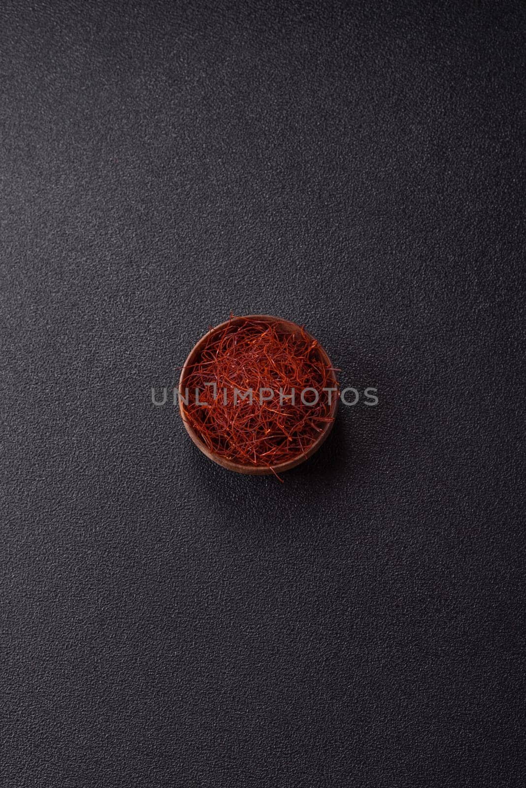 Red thin hot chili threads on a dark background. For decorating Asian dishes
