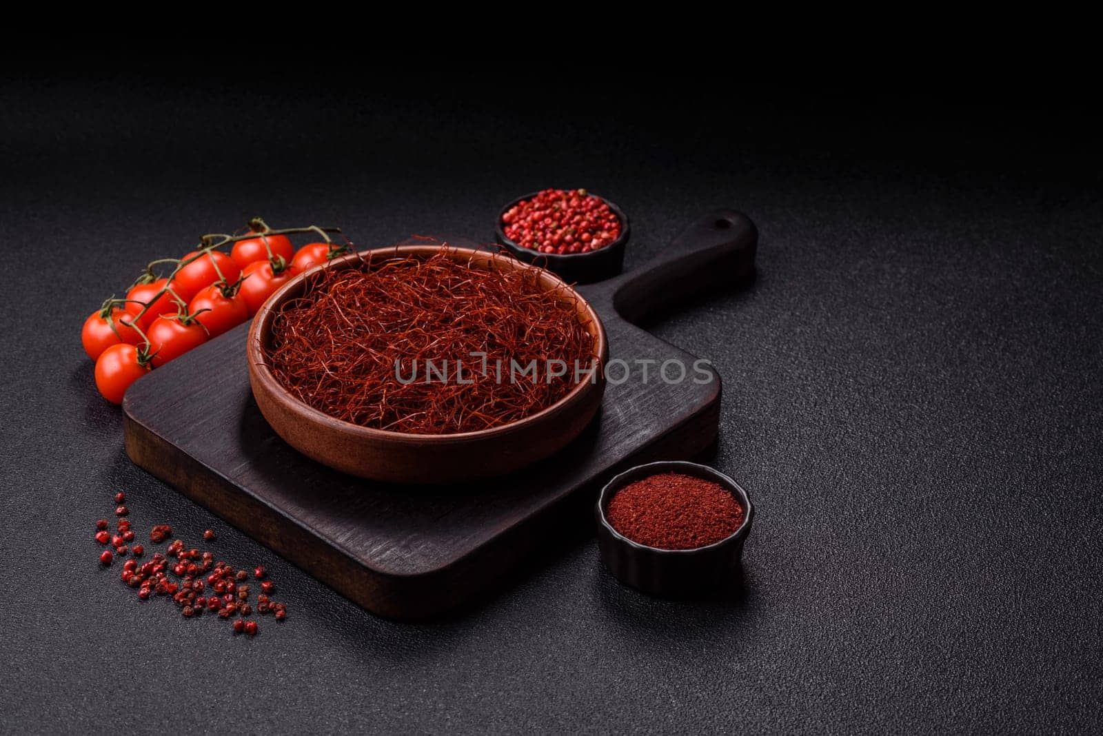 Red thin hot chili threads on a dark background. For decorating Asian dishes