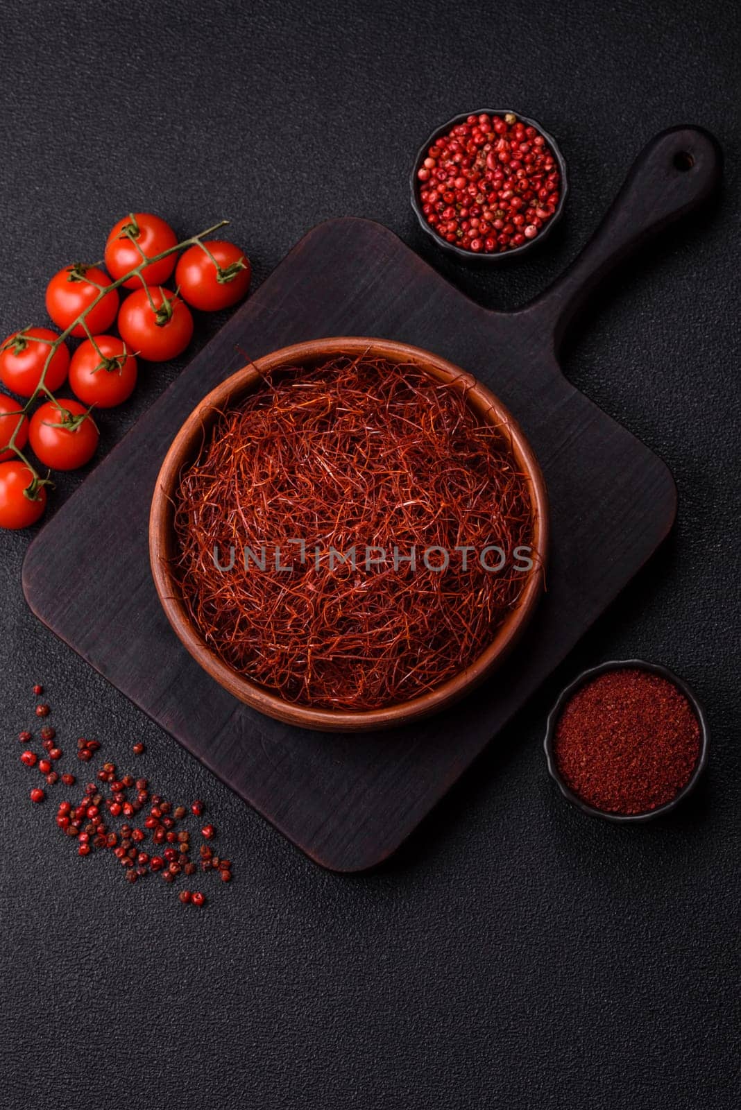 Red thin hot chili threads on a dark background. For decorating Asian dishes