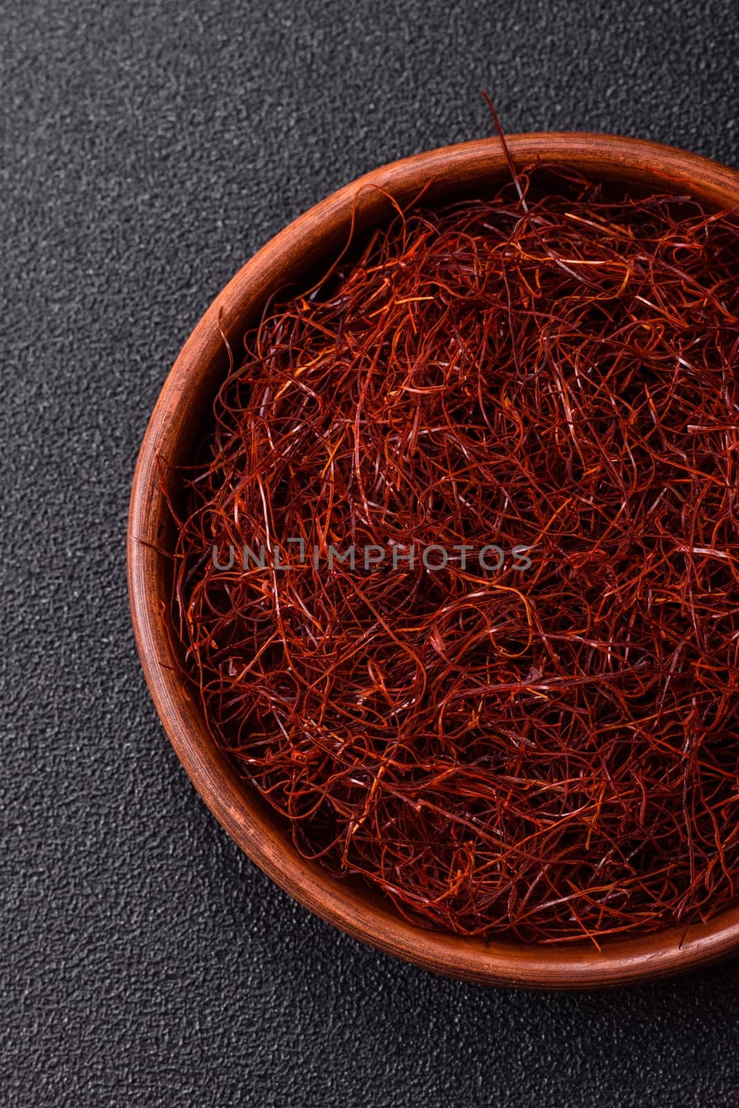 Red thin hot chili threads on a dark background. For decorating Asian dishes