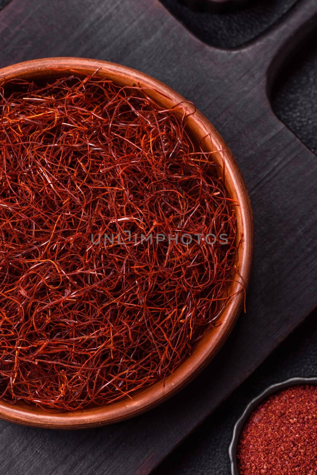 Red thin hot chili threads on a dark background. For decorating Asian dishes