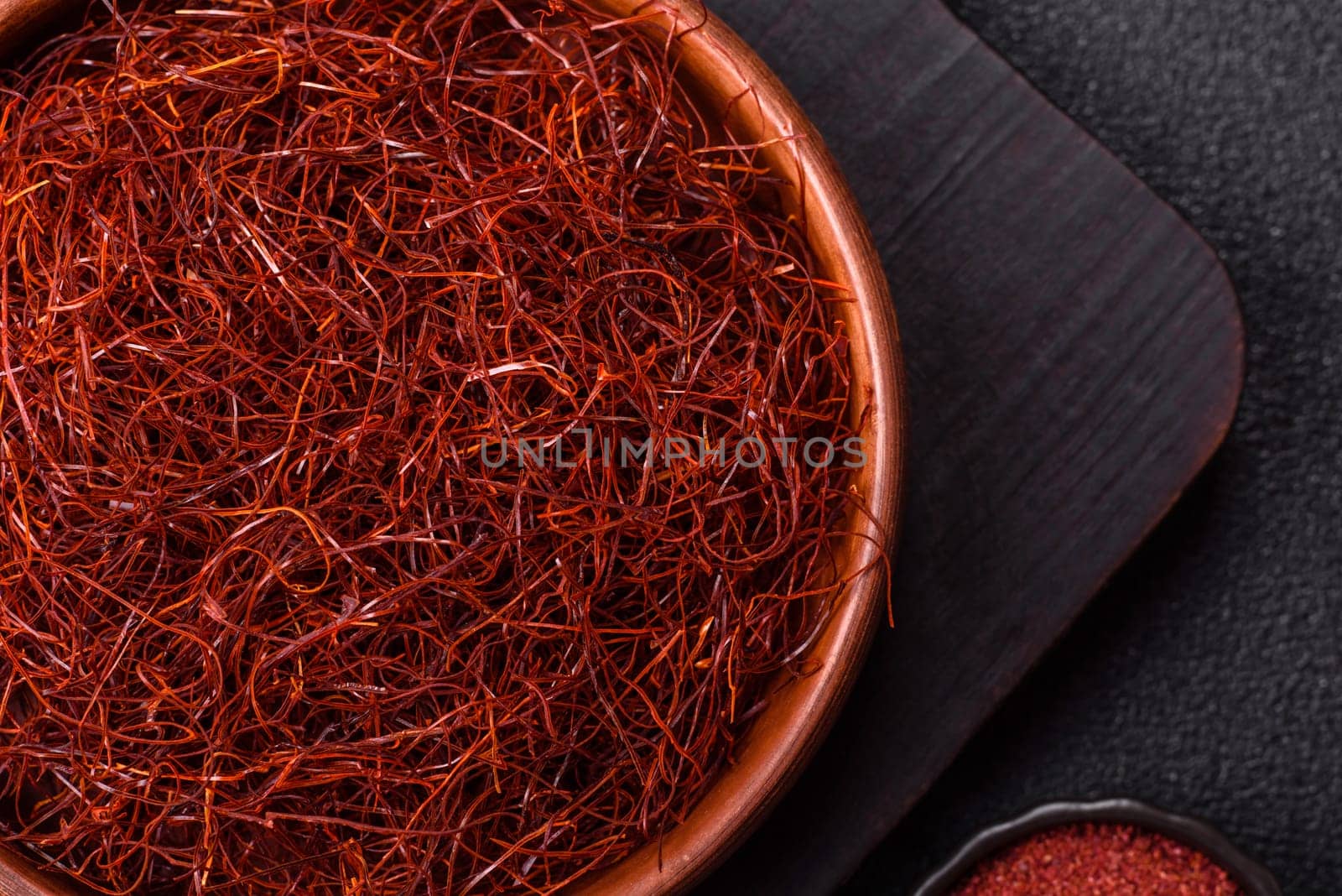 Red thin hot chili threads on a dark background. For decorating Asian dishes