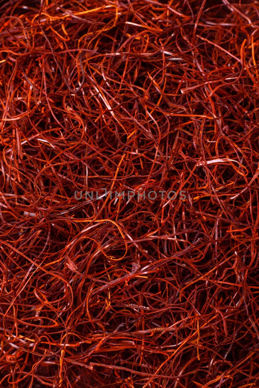 Red thin hot chili threads on a dark background. For decorating Asian dishes