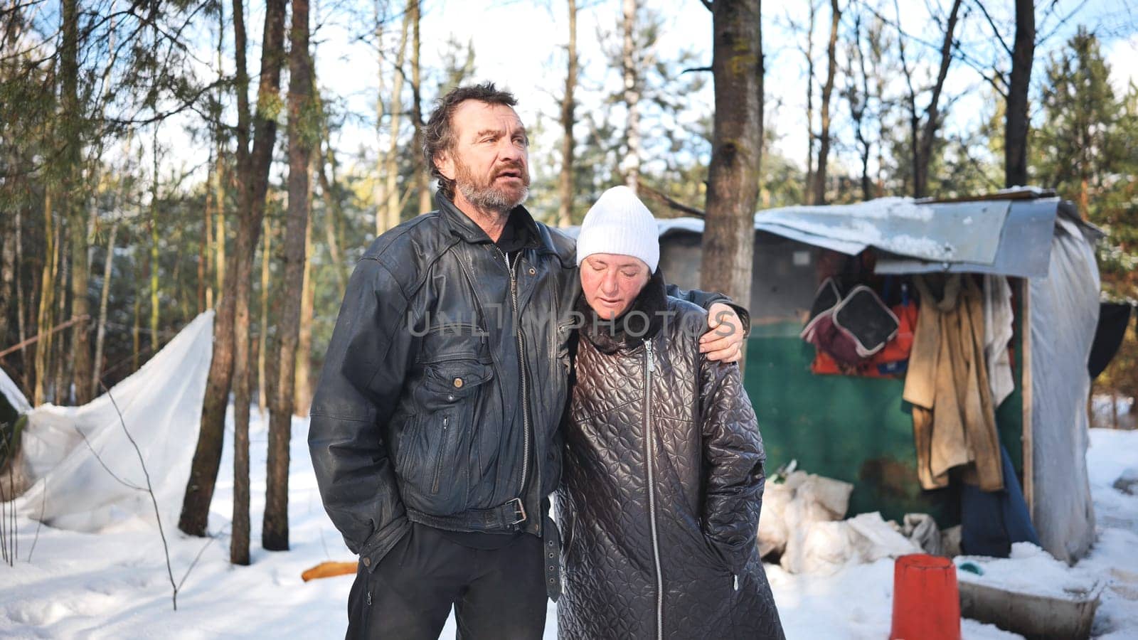 Homeless pair surviving harsh winter conditions, struggling with alcoholism in remote woodland setting