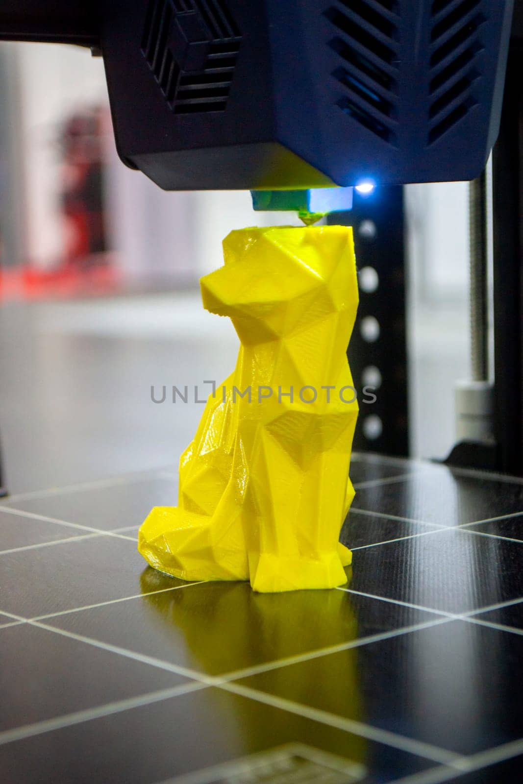 Abstract object printing on 3D printer with molten plastic close-up. 3D printer by Mari1408