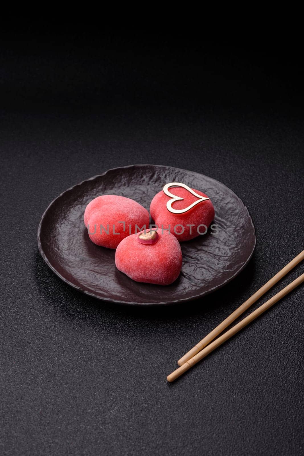 Delicious sweet mochi in the shape of red hearts for the holiday of Valentine's Day