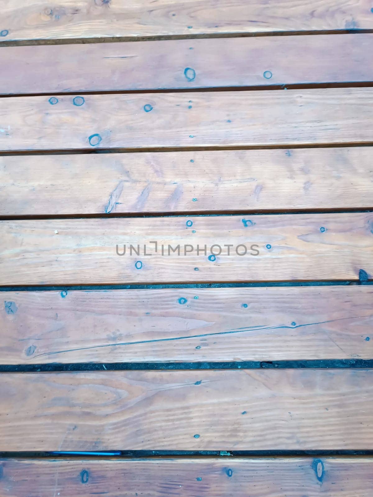 Weathered old wooden planks with visible grain patterns rustic inside interior texture background floor home . High quality photo